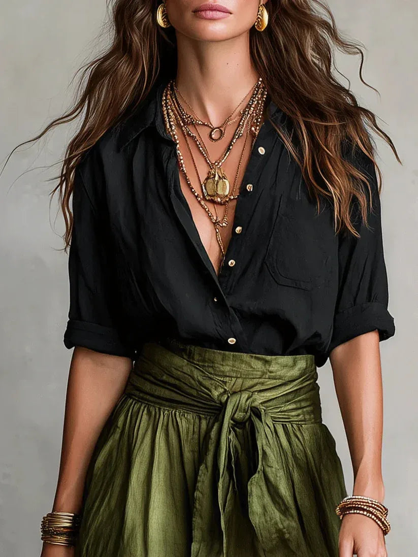 Conjunto Elegante de Dos Piezas con Blusa Negra y Falda Midi