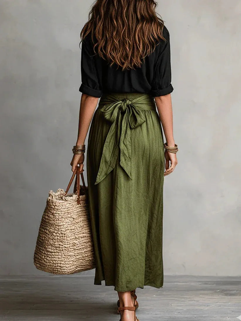 Conjunto Elegante de Dos Piezas con Blusa Negra y Falda Midi